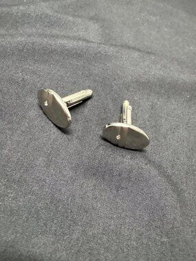 Silver Oval Cufflinks With Textured Back & Single Diamond Accent For Men